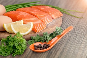 Fresh tasty fish for cooking dish on table with lemon