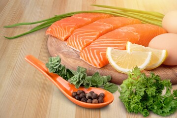 Fresh tasty fish for cooking dish on table with lemon