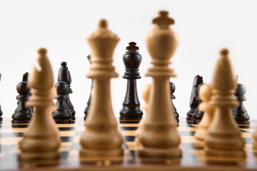 Vintage chess board with checkers, pawns, knights, rooks, bishops, queen and king, black and white colors. Chess board game for ideas and competition and strategy, business success concept.