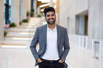 Confident young businessman in an office building
