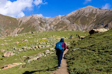 Beautiful mountain scenery. River, valley, snow, blue sky, white clouds. In-depth trip on the Sonamarg Hill Trek in Jammu and Kashmir, India