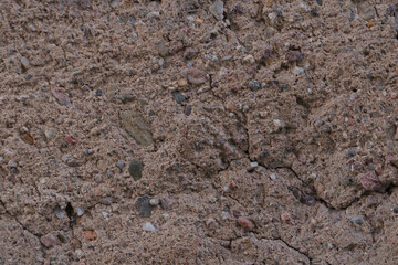 Bright dark red earth with stones. Rock. Earth background from another planet.