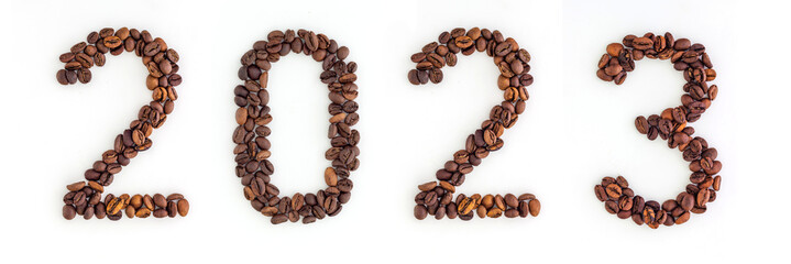 2023 headline from roasted coffee beans on white background