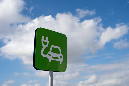 Green sign of car electric charging station.