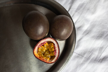 fresh passionfruit on table. cutted maracuya