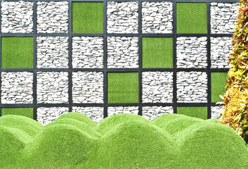  stone wall and artificial grass for the background