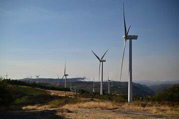 Wind energy. Clean renewable energy technologies. Wind power plants.Aerial view of horizontal-axis wind turbines generating electricity 