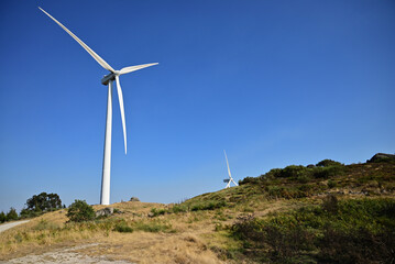 Fototapeta na wymiar Wind energy. Clean renewable energy technologies. Wind power plants.Aerial view of horizontal-axis wind turbines generating electricity 