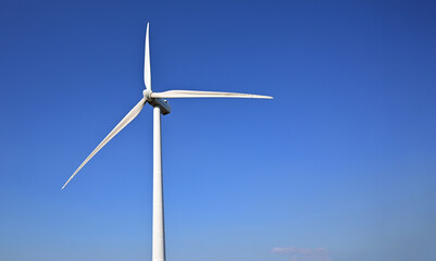 Wind energy. Clean renewable energy technologies. Wind power plants.Aerial view of horizontal-axis wind turbines generating electricity 