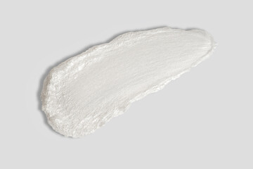 Skin care washing foam swatch smear isolated on white background.