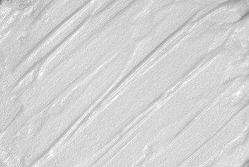 White smear of cosmetic cream. Creamy foundation texture.