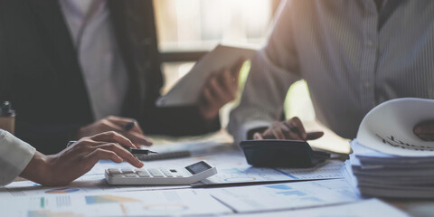 Asian business adviser meeting to analyze and discuss the situation on the financial report in the meeting room.Investment Consultant, Financial advisor and accounting concept