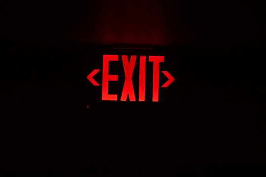 exit red light sign on black - Powered by Adobe