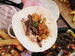 Indian crepes dish with various fresh vegetable ingredients on the crust