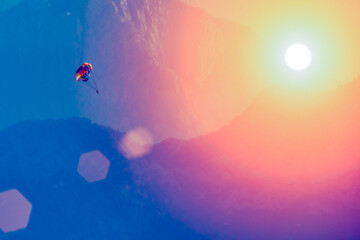 Active lifestyle, sports flights. Paragliding against a beautiful mountains