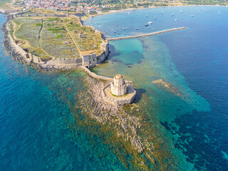 Aerial drone view of venetian castle and the octagonal tower called Bourtzi in Methoni, Messenia, Peloponnese, Greece