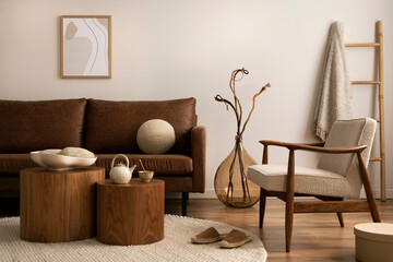 Interior design of stylish and elegant room with brown sofa, boucle armchair, wooden coffee tables,...