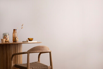 Minimalist composition of dining interior with round wooden table, design chair, copy space, kitchen stuff, decoration and personal accessories. Stylish home decor. Template.