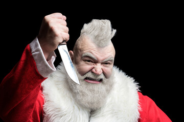 Bad angry Santa Claus killer threatening with a knife. Freak santa wishes merry christmas and new...