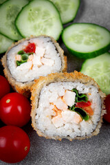 Fried sushi rolls with rice, chicken and herbs
