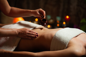 Professional massege woman client working at spa center. Young beautiful woman relaxing during full...