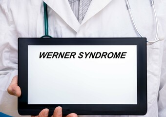 Werner Syndrome.  Doctor with rare or orphan disease text on tablet screen Werner Syndrome