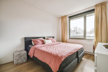Soft bed and nightstand in modern light bedroom