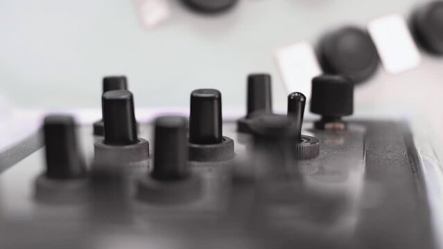 Mans hand presses the toggle switches and buttons