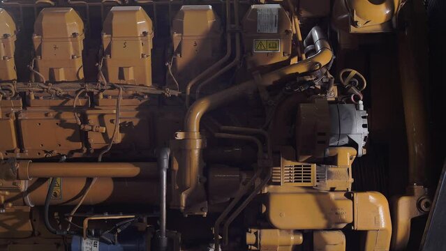 Big yellow ships motor in the engine room 