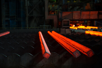 Steel manufacturing process,steel bars are taken out of the furnace to be processed. Photographed...