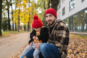 Fototapeta premium A father and his son spend time together. Happy parenthood. Father and toddler. Parental love.