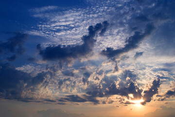 Naklejka na ściany i meble Blue sky with dark clouds on a summer August evening. Sunset