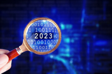 Magnifier discovering 2023 number in cyberspace