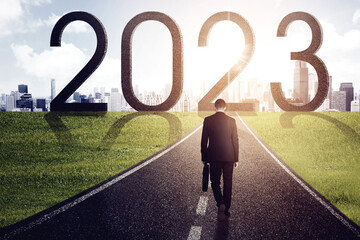 Male manager walking toward 2023 number