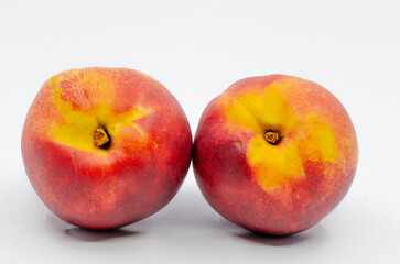 Red colored nectarines. Red nectarine fruit isolated on white background.
