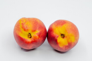 Red colored nectarines. Red nectarine fruit isolated on white background.
