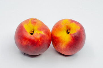 Red colored nectarines. Red nectarine fruit isolated on white background.
