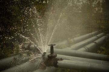 Burst pipe. Water pouring. Pipeline accident. It's dangerous situation.