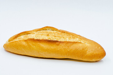 Hot bread out of the oven. Loaf of bread on a white isolated background. The staple food is bread.
