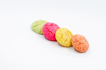 Colorful cookies lined up side by side. Colorful cookies on a white isolated background.
