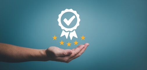 Businessman holding sign of the top service Quality assurance, Satisfaction Guarantee, Standards, ISO certification and standardization concept. 