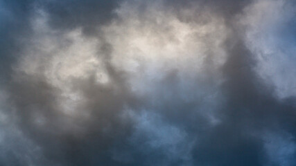 Texture of bright blue dramatic cloudy sky.