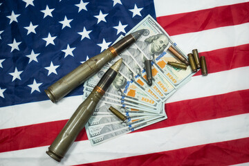 American flag with dollars money, bullets, shells, cartridges and projectiles on it. Lend-Lease...