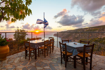 Romantic terrace during sunset at a restaurant on Zakynthos (Ionic Islands, Kampi, Greece)