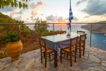 Romantic terrace during sunset at a restaurant on Zakynthos (Ionic Islands, Kampi, Greece)