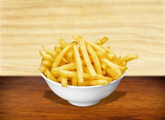 Tasty fast food French fries in plate