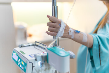 Giving saline to the hand of a patient medical treatment.