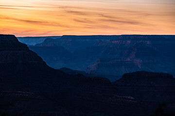 Silhouettes Of Grand Canyon Ridges In Late Evening