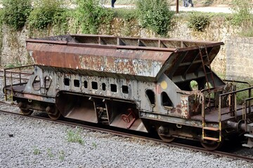 Historic bulk cargo freight wagon parked as tourist attraction in Fond-de-Gras station, Luxembourg