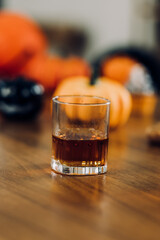 Collection of a glass of whiskey and wine on the bar.	
